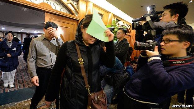 Relatives of victims from the missing Malaysia Airlines Boeing 777-200 plane leave after applying for their Chinese passports to be ready for travel to Kuala Lumpur to be closer to the rescue operations, in Beijing on March 10, 2014.