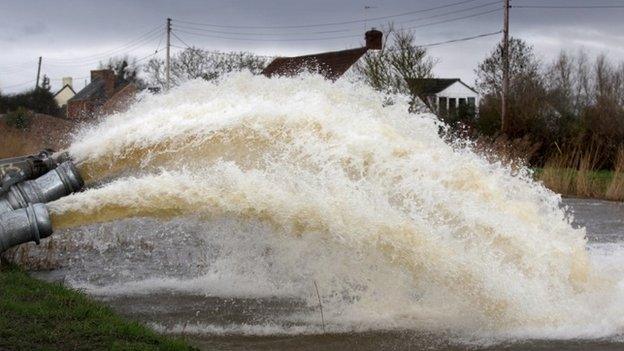 Flood water is pumped into the River Parrott by the Environment Agency in Moorland