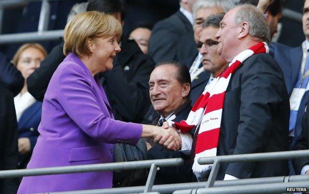 File pic of Chancellor Angela Merkel with Uli Hoeness for the Champions League final in May 2013