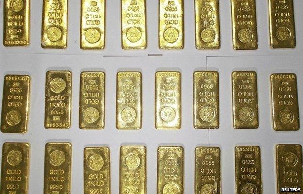 Seized gold bars are kept on display by customs officers at the international airport in Calcutta on November 19, 2013