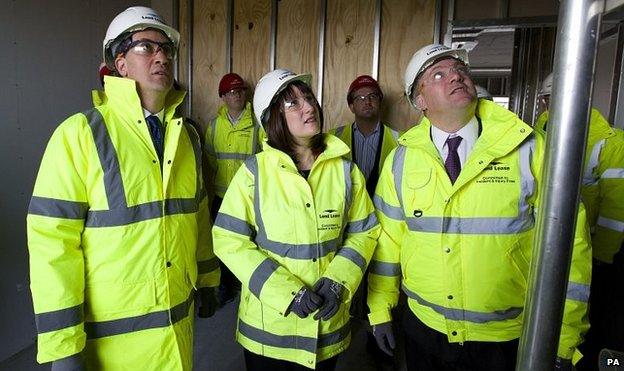 Ed Miliband (left), Rachel Reeves (centre) and Ed Balls (right) visit a building site in London