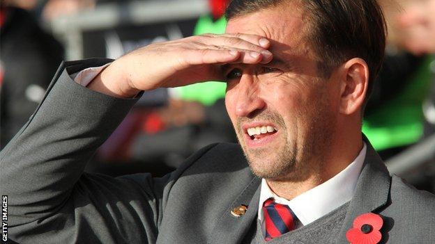 Justin Edinburgh looks on as Newport play.