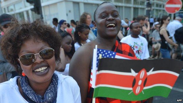 Fans of US President Barack Obama are pictured with the flag of Kenya in Berlin, on 19 June 2013