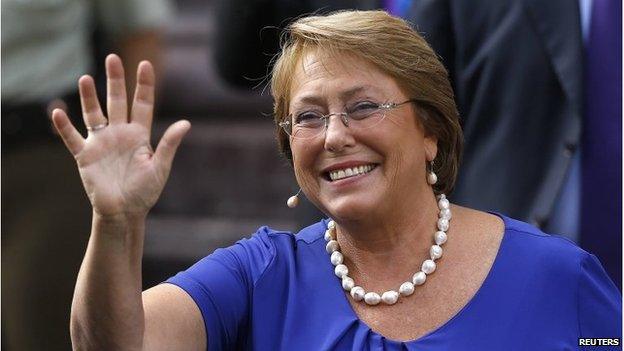 Chiles President-elect Michelle Bachelet waves to the media as she leaves after several meetings with authorities in Santiago on 10 March, 2014