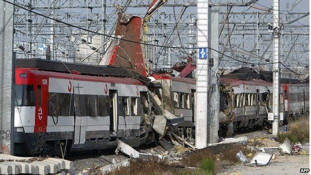 Damaged commuter train carriages at the Atocha train station in Madrid on 11 March 2004