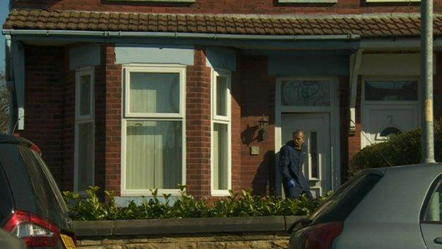 A house being searched by in the Levenshulme area of Manchester