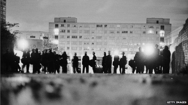 Police officers in riot gear on the Broadwater Farm housing estate