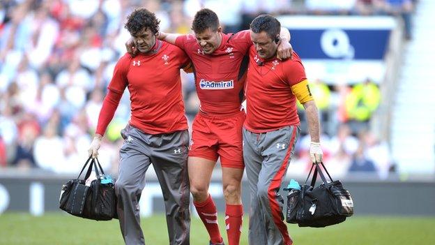 Wales' Rhys Webb leaves the field injured