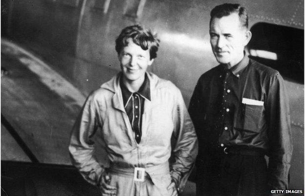 American pilot and pioneer Amelia Earhart, with her navigator Captain Fred Noonan, in the hangar at Parnamerim airfield, Natal, Brazil, 11th June 1937