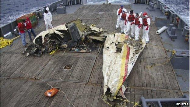 A Venezuelan rescue team inspects the wreckage of the Britten-Norman BN-2 Islander aircraft YV-2615 after it was recovered from the seafloor near the archipelago of Los Roques in this November 2013 handout photo. The air and sea rescue services believe the plane was carrying 58-year-old Italian fashion executive Vittorio Missoni, his wife and four other people when it went missing off the coast of Venezuela.