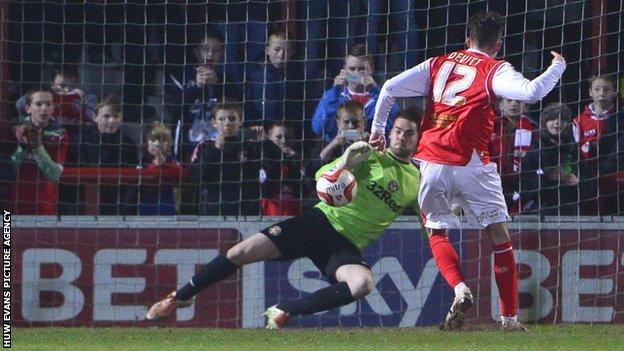 Jamie Devitt scores from the penalty spot against Newport County