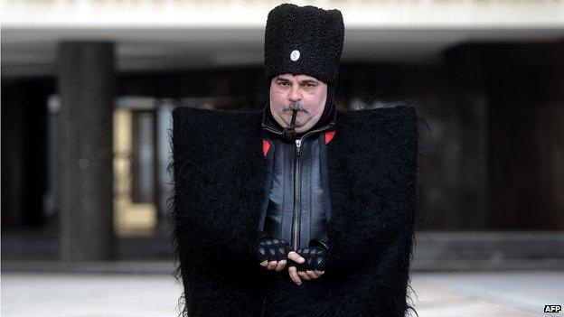 Cossack guard in front of Crimea's regional government in Simferopol on 12 March 2014