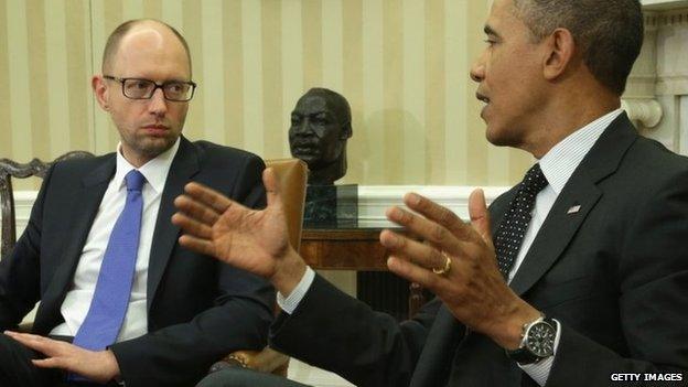 US President Barack Obama (R) meets with Prime Minister of Ukraine Arseniy Yatsenyuk (L) in the Oval Office of the White House 12 March 2014