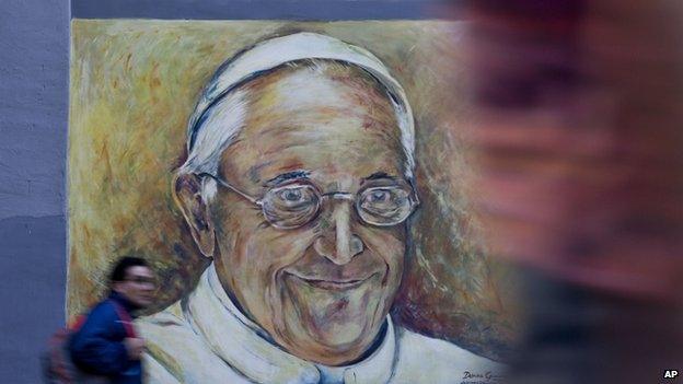 A mural of Pope Francis painted on the exterior of a hospital in Buenos Aires, Argentina (12 March 2014)