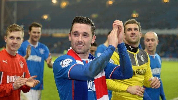 Rangers players celebrate League One title victory