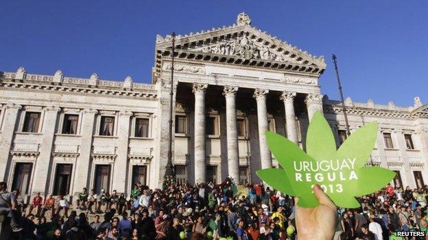 People participate in the so-called "Last demonstration with illegal marijuana" in front of the Congress building in Montevideo