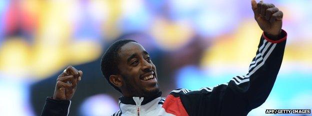 Jehue Gordon celebrates his 400m hurdle World Championship gold in 2013.