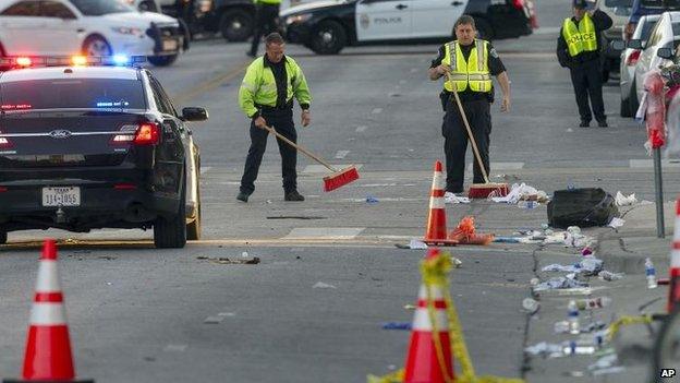 Police continue to work at the site in Austin, 13 March
