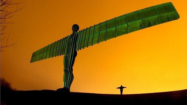 The Angel of the North lit green