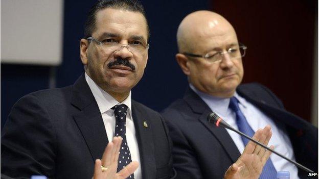 Interpol Secretary General Ronald Kenneth Noble (L) speaks next to Executive Director of Police Services Jean-Michel Louboutin in Lyon, France (11 March 2014)