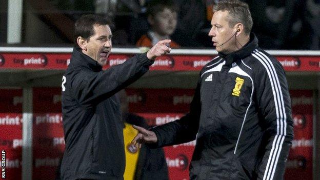 Jackie McNamara gesticulates in front of fourth official Iain Brines