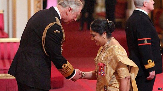 Dame Asha Khemka is made a Dame Commander by the Prince of Wales during an Investiture ceremony at Buckingham Palace in central London