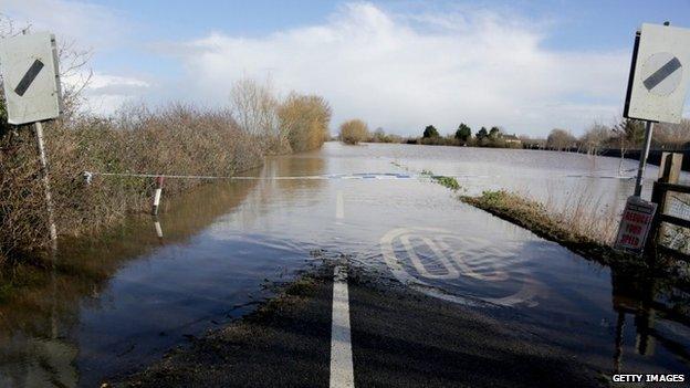 Flood water covers the main A361 road as it enters the village of East Lyng on February 13