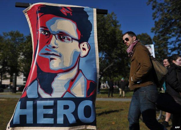 Portrait of Edward Snowden declaring him a "hero" during a protest against government surveillance in Washington, DC in January 2014