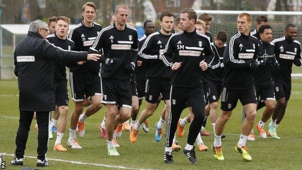 Fulham manager Felix Magath (left) takes a training session