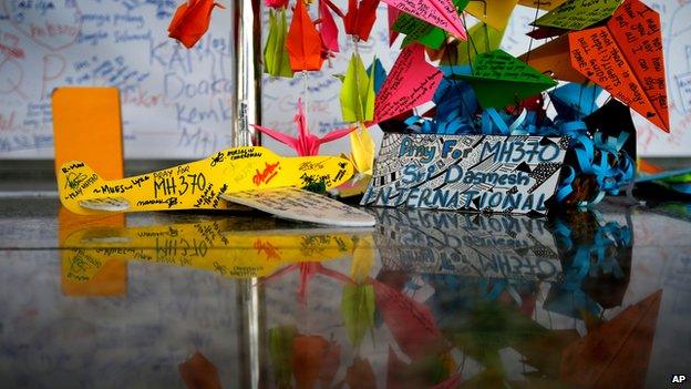 A foam plane and other messages at the viewing gallery at Kuala Lumpur airport on 15 March 2014