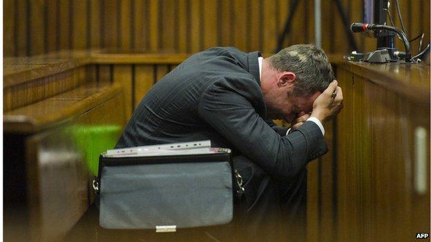 Oscar Pistorius reacts during his murder trial at the North Gauteng High Court in Pretoria, on March 13, 2014