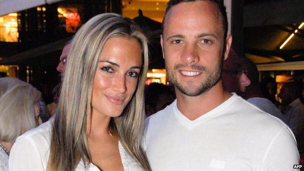 A picture taken on 26 January 26 2013 shows Olympian sprinter Oscar Pistorius posing next to his girlfriend Reeva Steenkamp at Melrose Arch in Johannesburg