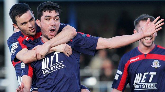 Emmett Friars (centre) celebrates his Portadown winner at Clandeboye Park