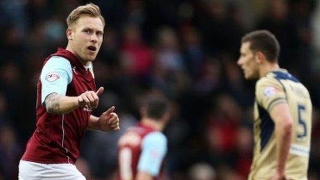 Scott Arfield celebrates after scoring Burnley's winner