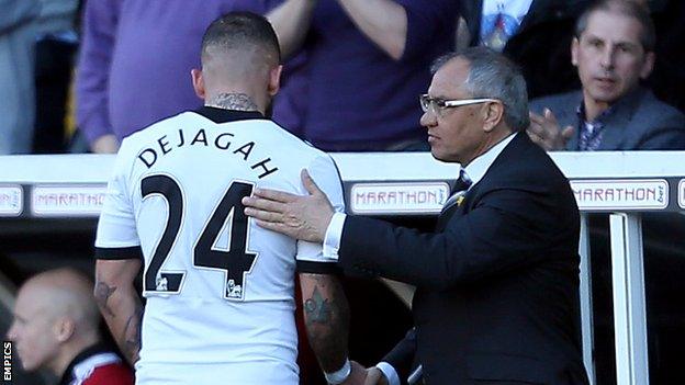 Fulham boss Felix Magath (right) shakes hands with Ashkan Dejagah, who scored the winner against Newcastle