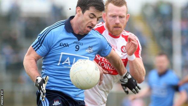 Derry's Fergal Doherty battles with Dublin's Michael Dara Macauley at Celtic Park