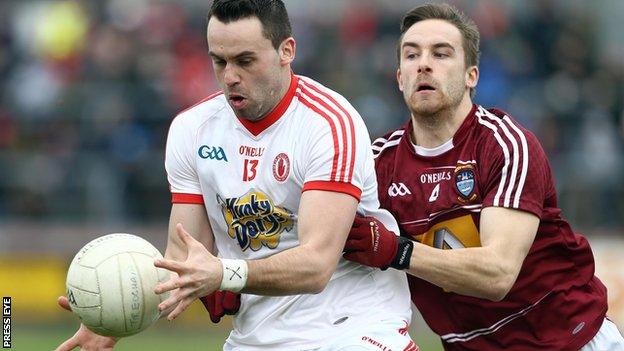 Kyle Coney is challenged by Kevin Maguire at Healy Park