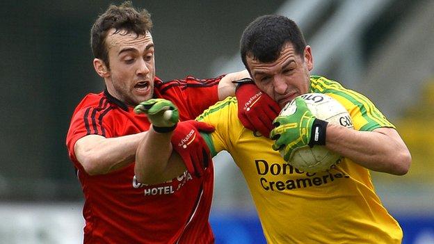 Down's Conor Laverty challenges Frank McGlynn at Pairc Esler