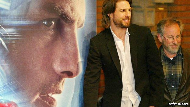 Tom Cruise and Steven Spielberg in front of Minority Report poster