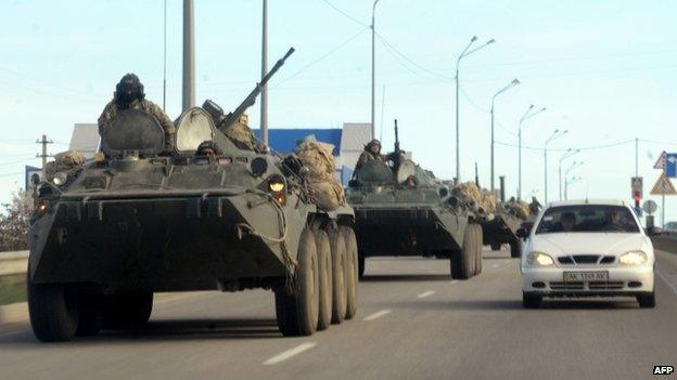 Russian armoured vehicles drive on the road between Simferopol and Sevastopol