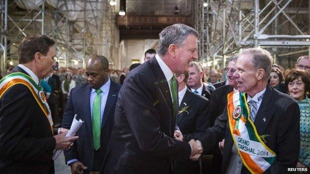 New York Mayor Bill de Blasio greets Grand Marshal of the 2014 New York St Patrick's Day Parade, John (Jack) Ahern, before a service at Saint 17 March 2014