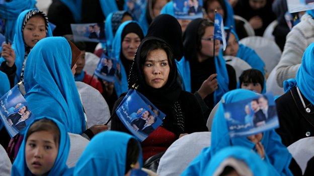 Female supporters of Zalmai Rassoul hold flags during a campaign rally in Kabul, Afghanistan