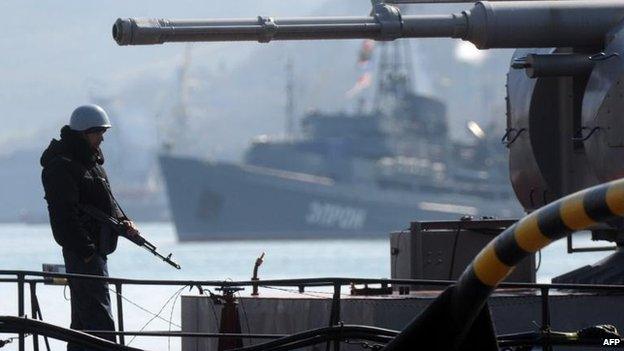 A sailor stands guard on Ukraine's Slavutych military ship in Sevastopol, 18 March