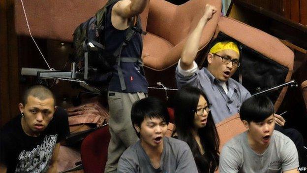 Protesters chant slogans during an anti-China demonstration at the Parliament in Taipei on 19 March 2014