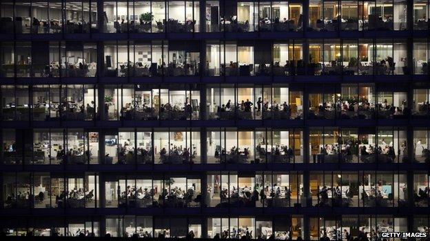 Office workers for IPC Media work late into the night in the Blue Fin Building in Southwark in 2010