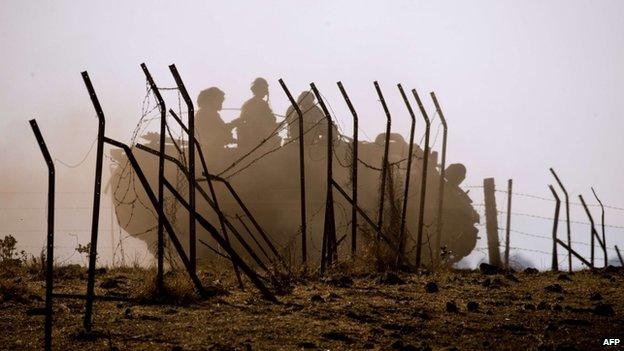 An Israeli army vehicle seen during a military exercise near the border with Syria on in June 2013 in the Israeli-occupied Golan Heights