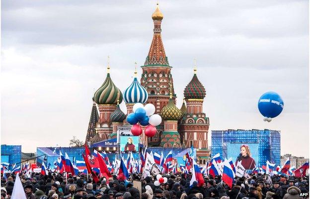 Pro-Kremlin activists rally in Moscow's Red Square on 18 March, to celebrate the incorporation of Crimea into the Russian Federation