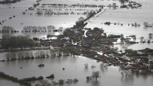 Water surrounds flooded properties in the village of Moorland on the Somerset Levels