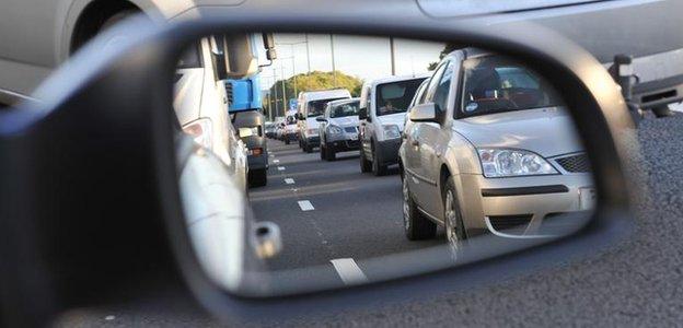 Traffic seen in wing mirror