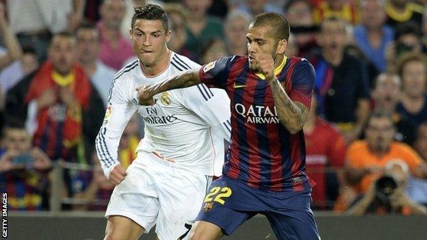 Real Madrid's Cristiano Ronaldo (left) and Barcelona's Dani Alves